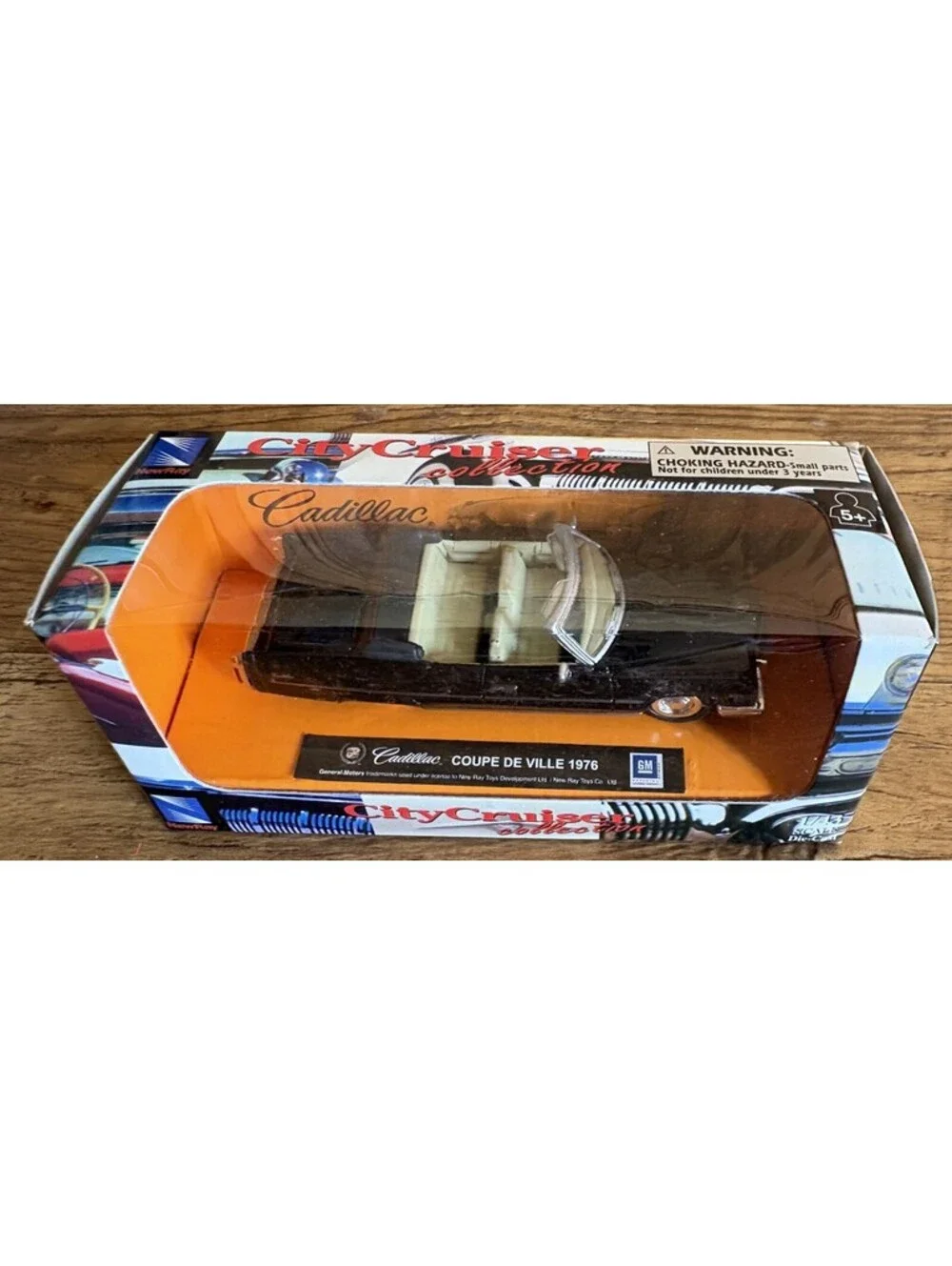 1976 Cadillac Coupe DeVille Convertible in Black - 1:43 New Ray City Cruiser